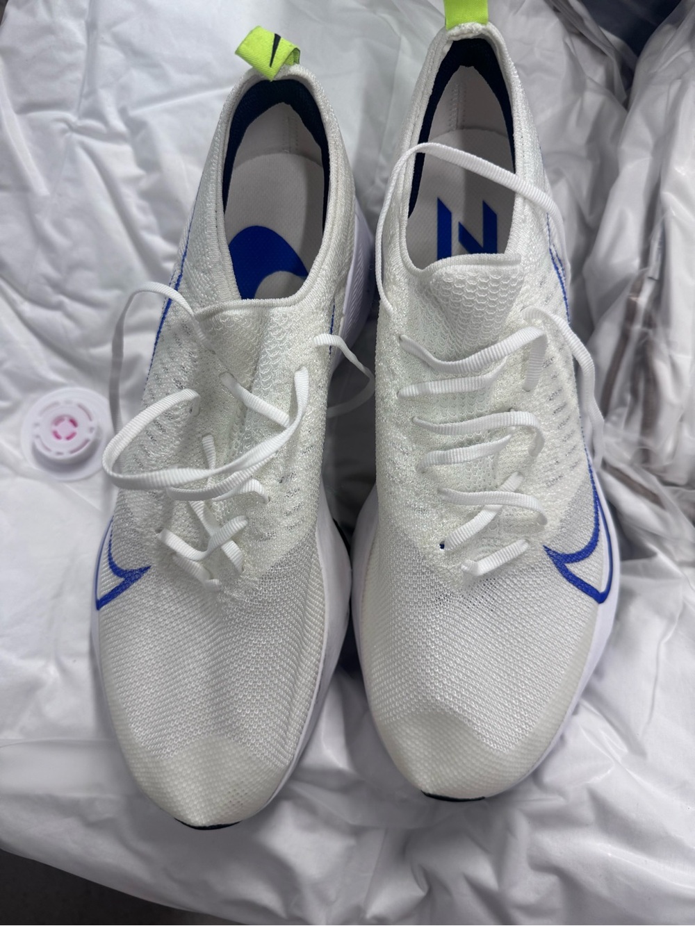 Nike White Running Shoes with Blue and Neon Green Accents